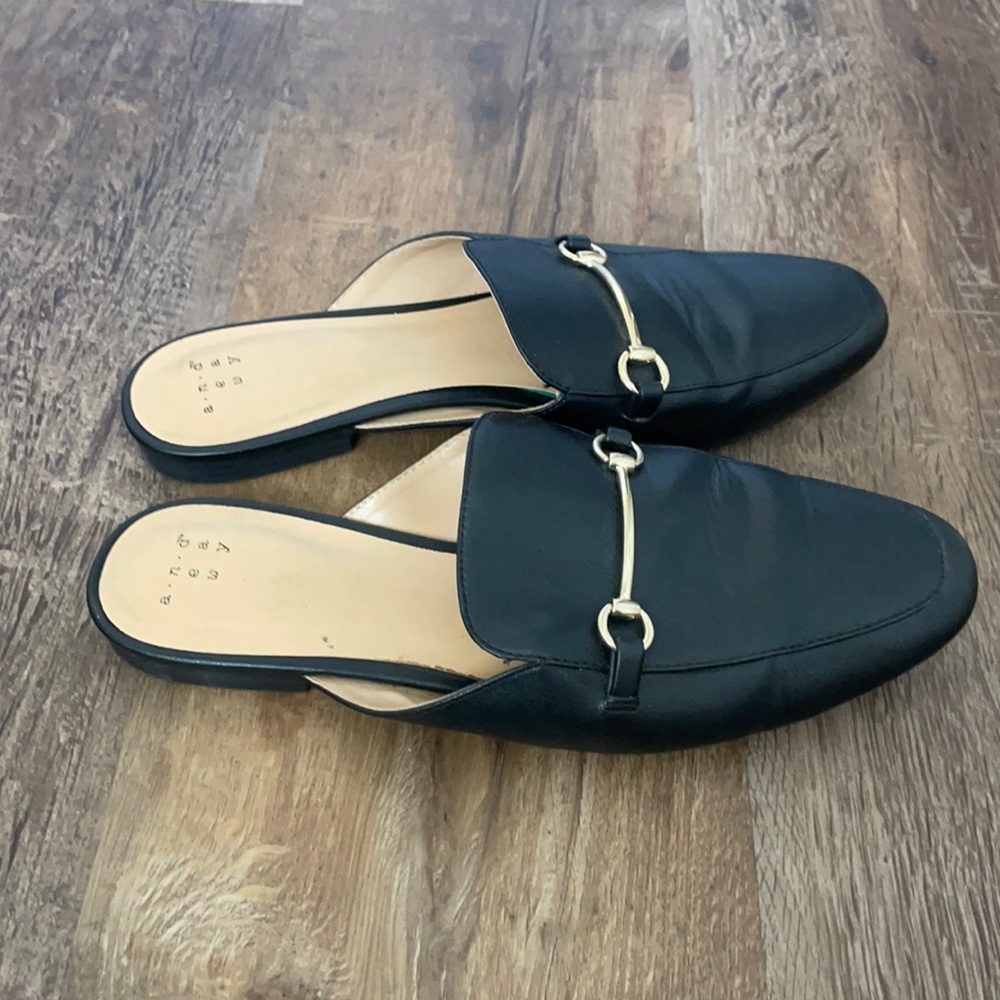 Black and gold loafers